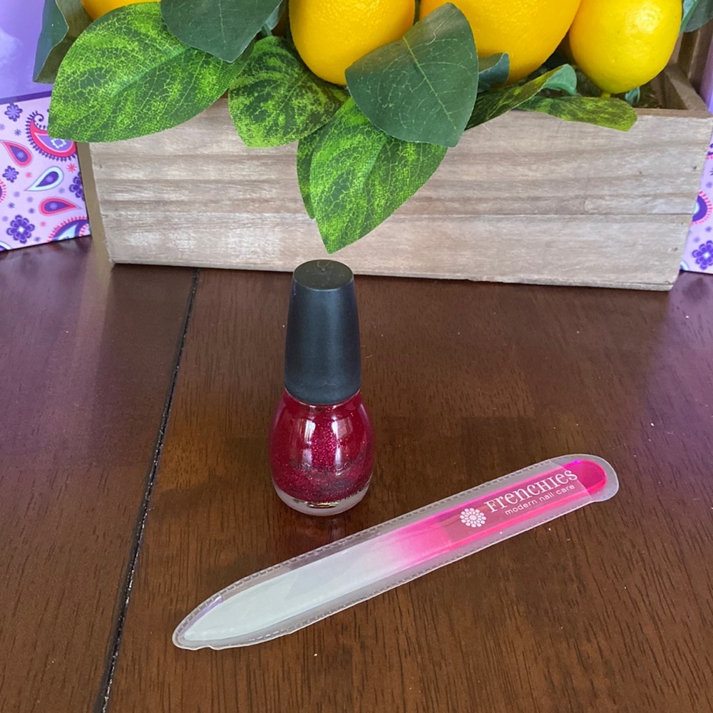 Sinful Colors nail polish with glass nail file. Never used! Red with glitter.